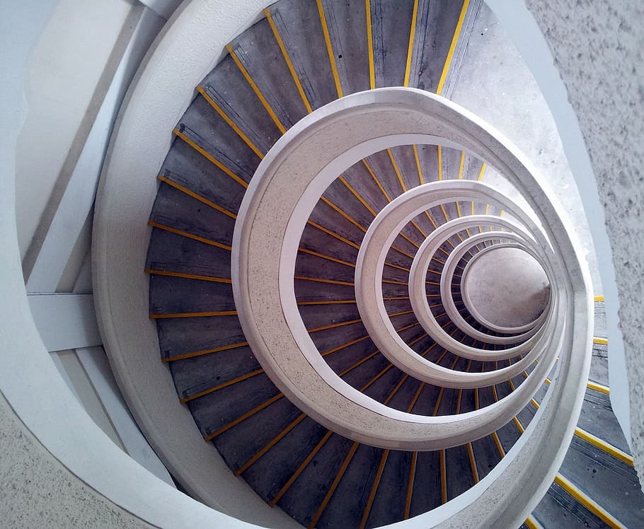 Image of spiral staircase conveying a sensation of vertigo